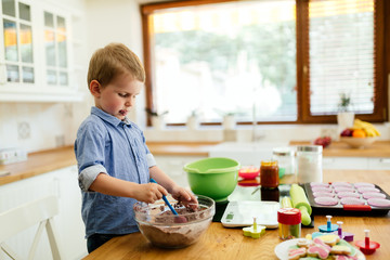 Adorable child making cookies