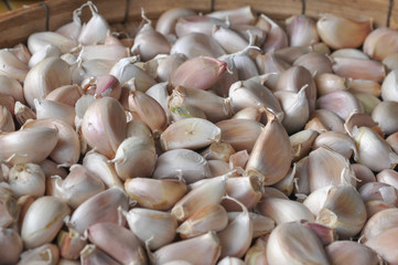 Garlic dried on wood basket background, selective focus