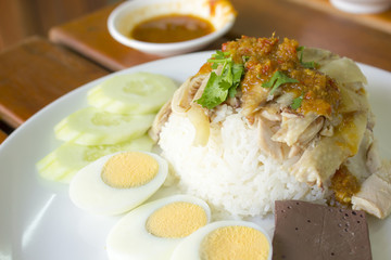 Hainanese chicken rice boil egg on white plate
