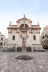 Stradun street at old part of the city early in the morning. Church of St. Blasius. Dubrovnic, Croatia.