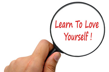 Learn To Love Yourself word. Magnifier and puzzles.