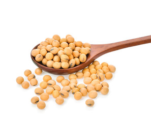 soy beans in wooden spoon on white background