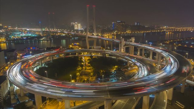 Night time lapse of traffic driving over the famous Nanpu bridge in Shanghai, China