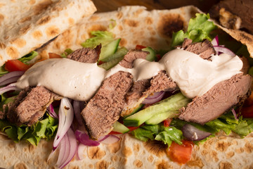 Doner kebab - fried beef meat with vegetables