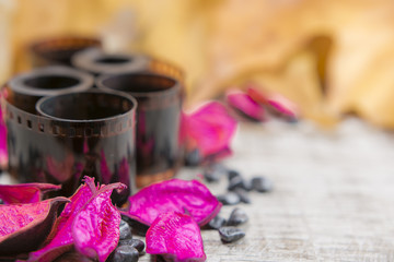 Old photographic film on a wooden background