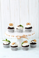 Chocolate cupcakes on a blue wooden table