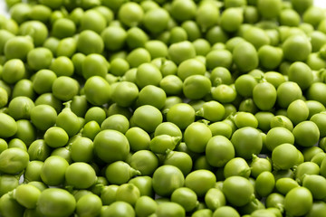 Fresh green peas background, close up