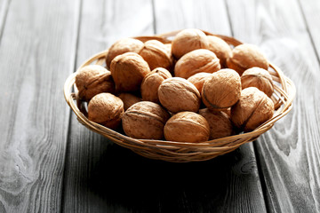 Walnuts on a black wooden table