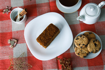 Beautiful homemade cookies on the New Year's holiday. On the table, tea, teapot, tree, toys. The concept for the new year holiday. View from above