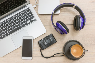 Creative professional's work table and tech gadgets from above - obrazy, fototapety, plakaty