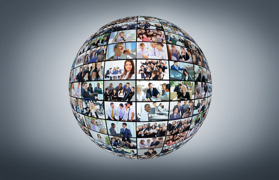 A globe is isolated on a white background with many different business people