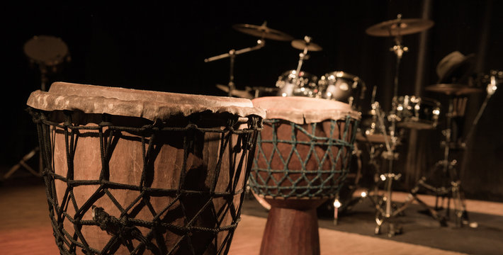 Traditional wooden african djembe drumon stage