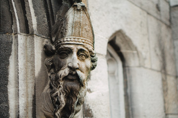 Bishops face adorns a doorway.