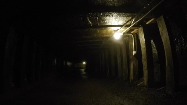 A tunnel deep inside a dark coal mine