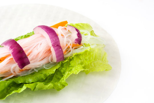 Vietnamese rolls with vegetables, rice noodles and prawns isolated on white background

