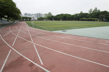 running track with lawn ground