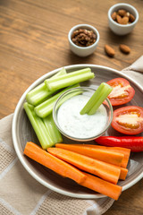 Vegetarian healthy snacks, vegetable snack: carrots, celery, tom
