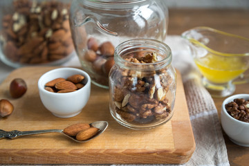 Assorted nuts: walnuts, almonds, hazelnuts and honey