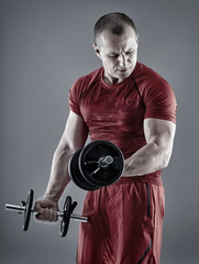 Man doing biceps curl with dumbbells