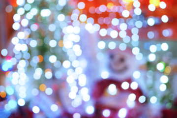 Christmas abstract defocused background, snowman dressed as Sant