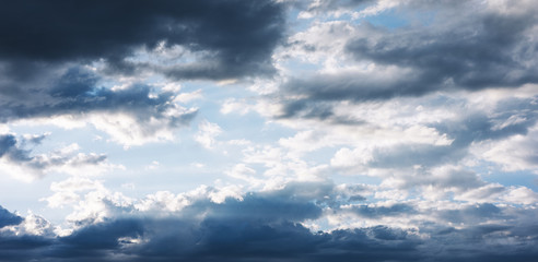 Clouds blue sky and sunlight sunset on horizon ocean. Сloudscape on background seascape dramatic atmosphere rays sunrise. Relax view waves sea, mockup nature evening concept.