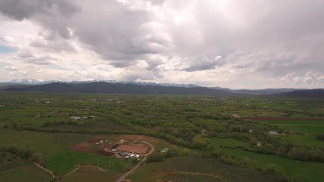 An aerial shot of gorgeous green mountain valley in spring