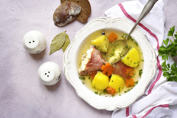Fish soup with sea perch and vegetables.Top view.