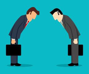 Two businessmen bowing each other