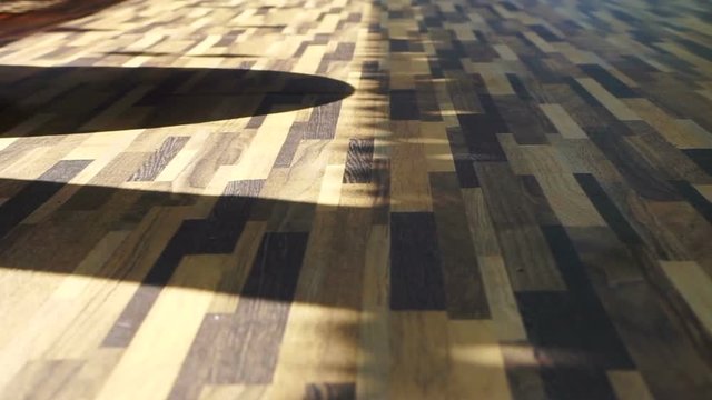 Morning sun shining on Beautiful wood texture vinyl floor, interior material