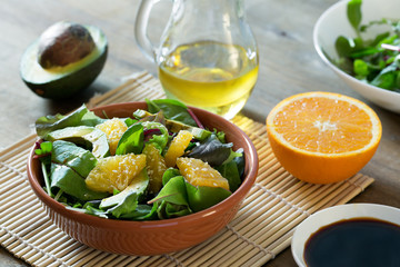 Fresh salad with avocado and orange