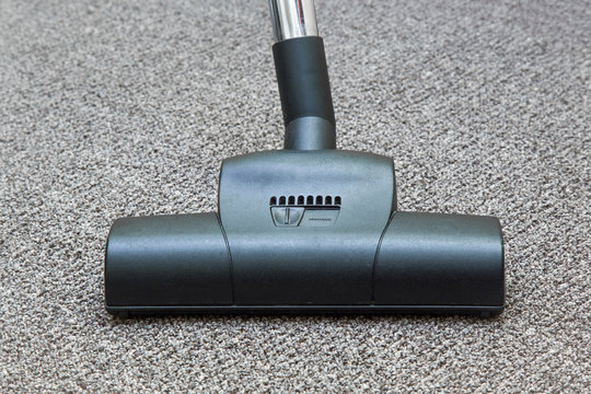 Professional vacuum cleaner turbo brush frees the carpet from dust. Early spring cleaning or regular clean up.