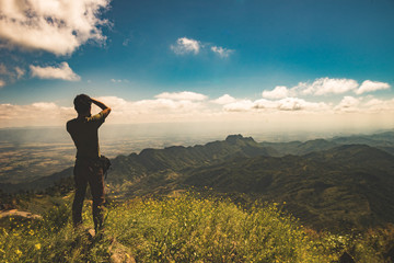 Nature photographer taking photos in the mountains..