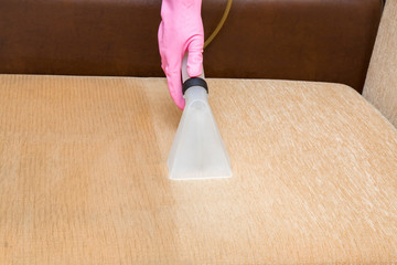 Sofa chemical cleaning with professionally extraction method. Upholstered furniture. Early spring cleaning or regular clean up. Wet and dry side.