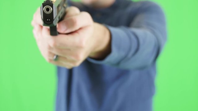 A green screen shot of man with a 22 pistol