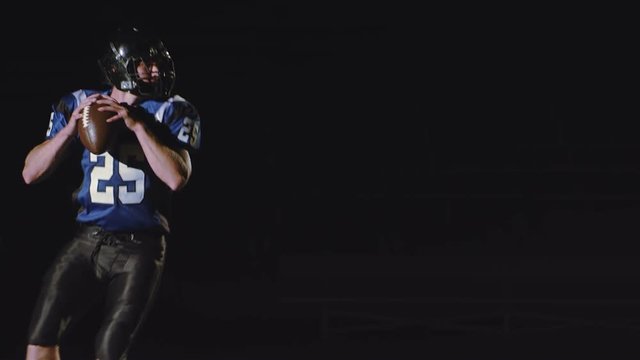 A quarterback runs with the ball, throws it, and then pumps his fist