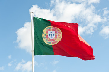 Flag of Portugal against blue sky