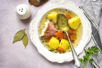 Fish soup with sea perch and vegetables.Top view.