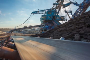 Long conveyor belt transporting ore