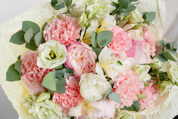 beautiful bouquet made of different flowers with in woman hand . colorful color mix flower
