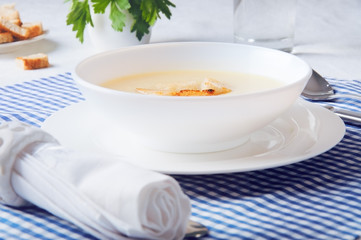 Dried croutons on white plate served on the table