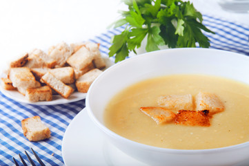 Dried croutons on white plate served on the table