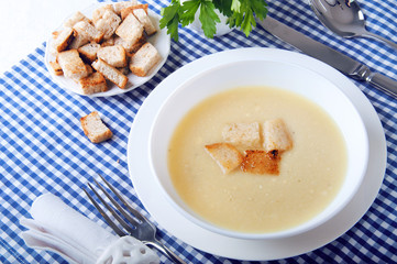 Dried croutons on white plate served on the table