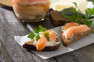 Salt fillet of salmon with butter on rye bread, breakfast concep