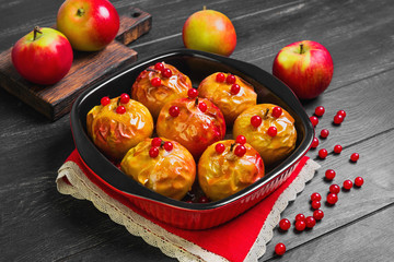 Baked apples baking in oven.