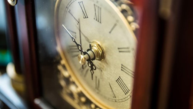 A timelapse shot of a cool clock with its hand rotating as time passes
