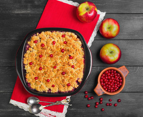 Dessert crumble cake with apples and red berries