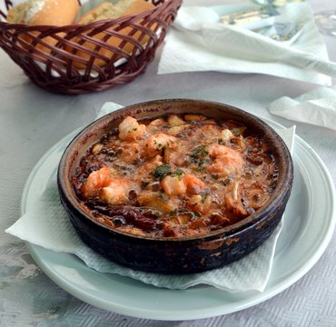Sizzling prawns with garlic. Traditional Spanish tapas dish.