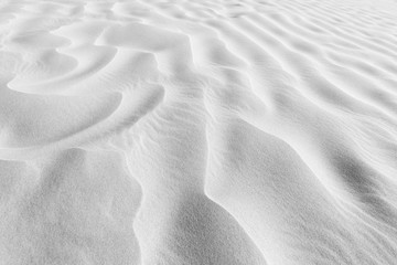 Sand  ripples texture shadows desert dune black and white.