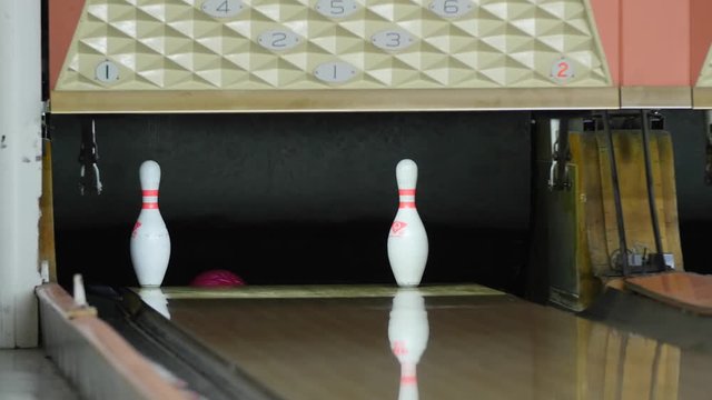 Bowling ball misses the pins at the bowling alley