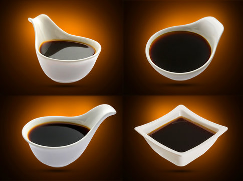 Soy sauce in white bowl isolated, shoyu closeup in dish